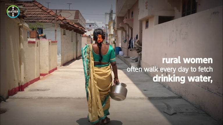 rural woman walking for water.jpg
