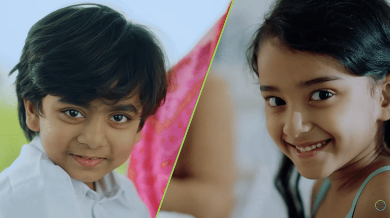 A smiling boy and a girl