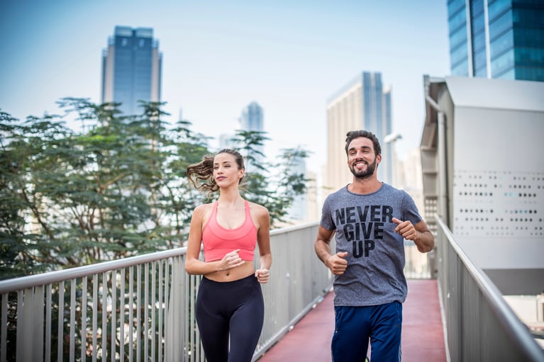couple_running_on_footbridge.jpg
