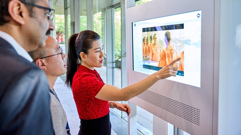 bayer-employees-at-a-touchscreen-1.jpg