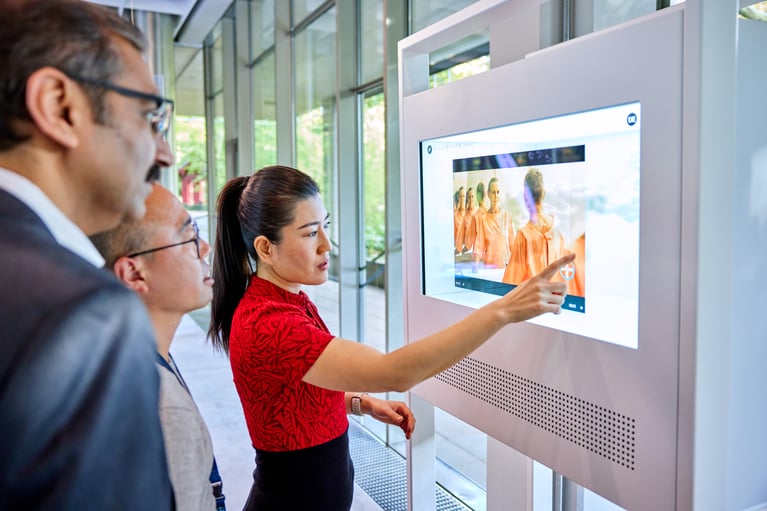 bayer-employees-at-a-touchscreen-1.jpg