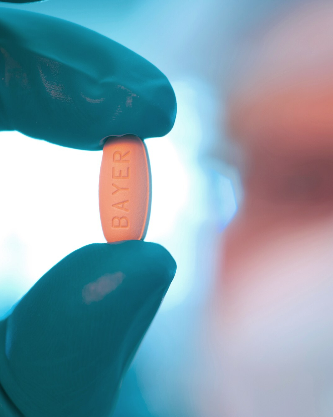 Hand holding Regorafenib tablet 3