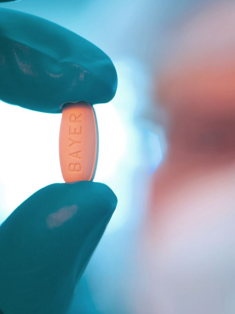 Hand holding Regorafenib tablet 3