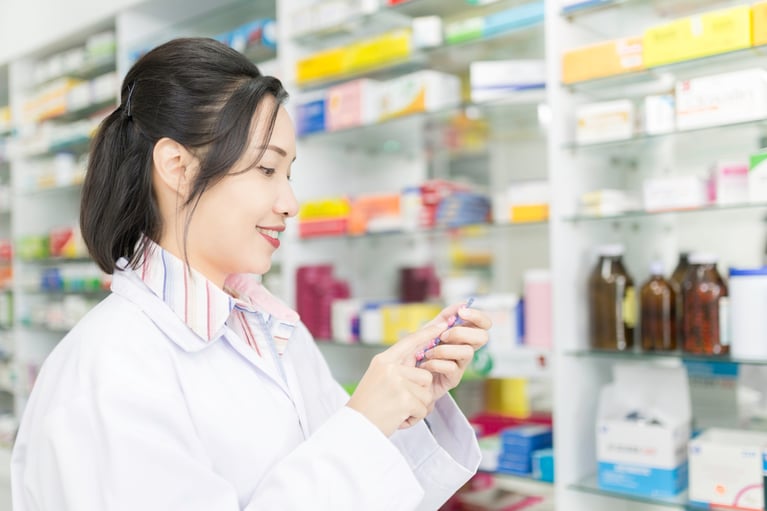 asian_pharmacist_in_a_drug_store.jpg