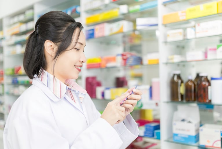 asian_pharmacist_in_a_drug_store.jpg