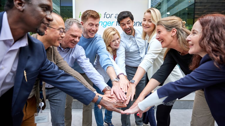 employees-put-their-hands-together-2.jpg