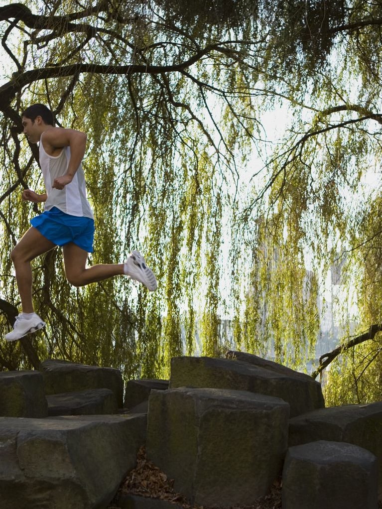 running_man_jumping_over_rocks.jpg