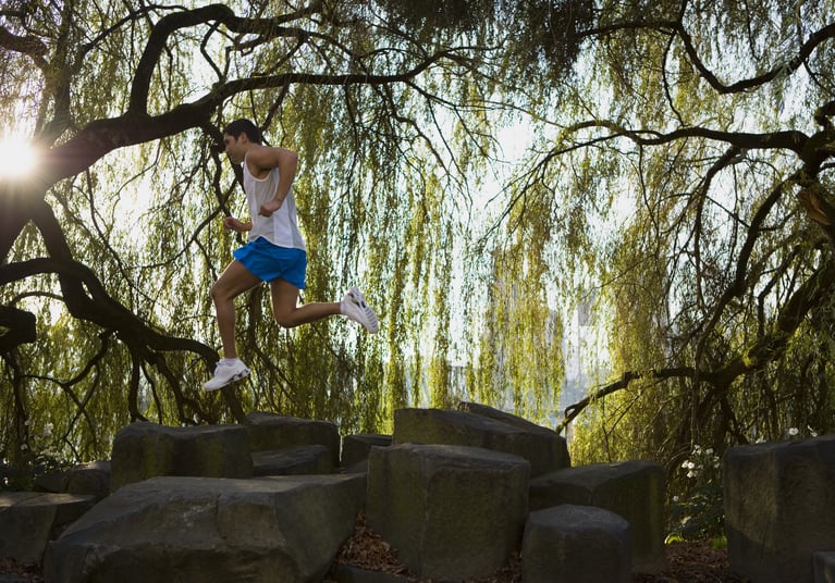 running_man_jumping_over_rocks.jpg