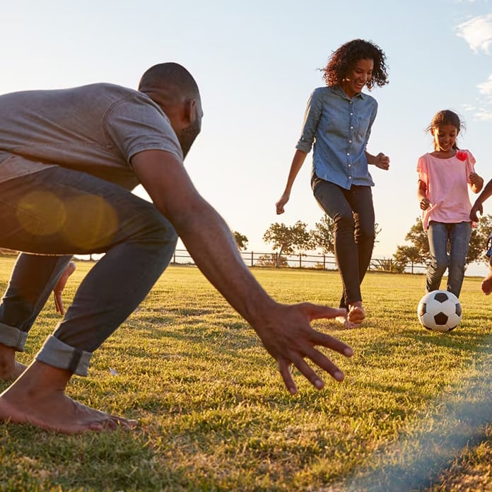 family playing soccer 