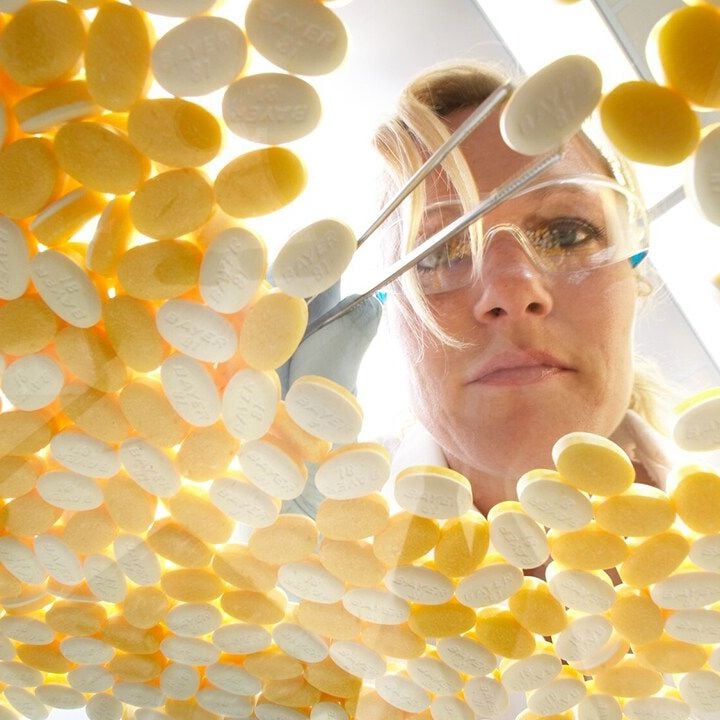 researcher with aspirin tablet 1280x720