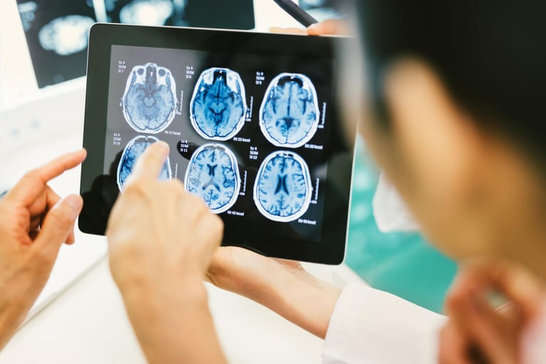 doctor and patient looking at tablet 4