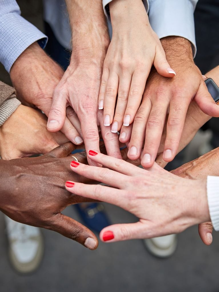 employees-put-their-hands-together-1 (1).jpg