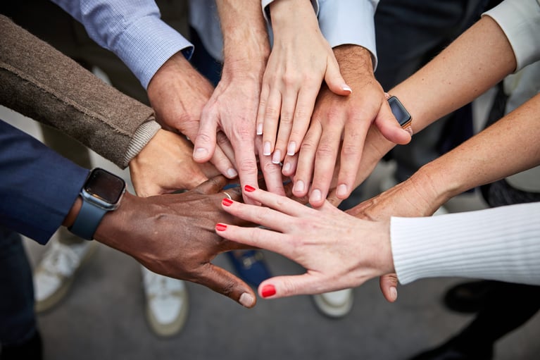 employees-put-their-hands-together-1 (1).jpg