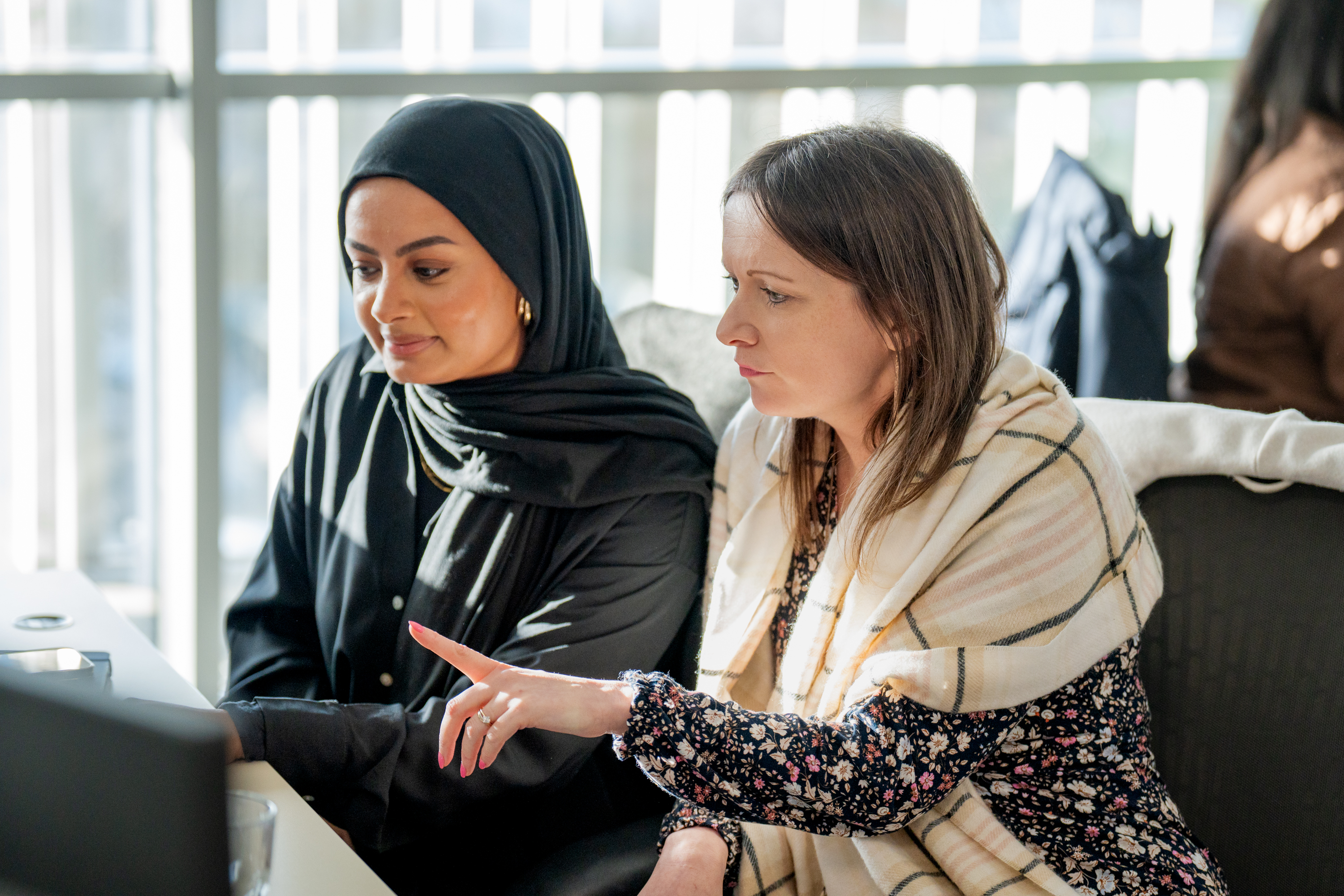 Two-women-looking-at-laptop.jpg