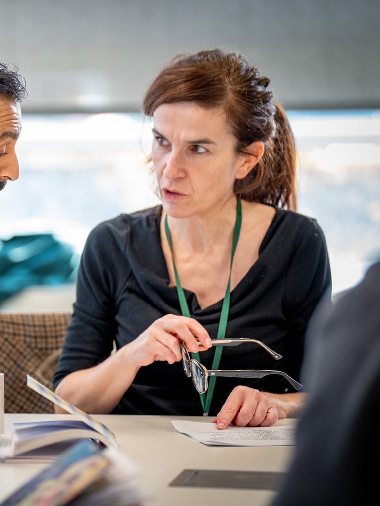 man and woman discussing over book.jpg