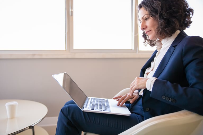 business_woman_working_in_lounge.jpeg
