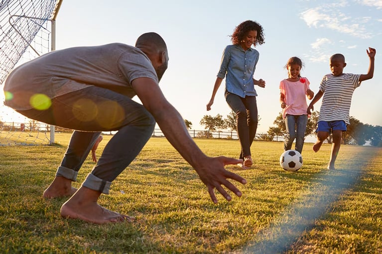 family playing soccer 