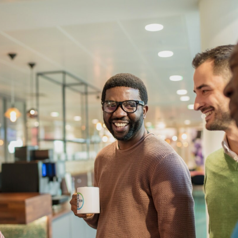 Employee at Bayer holding a mug