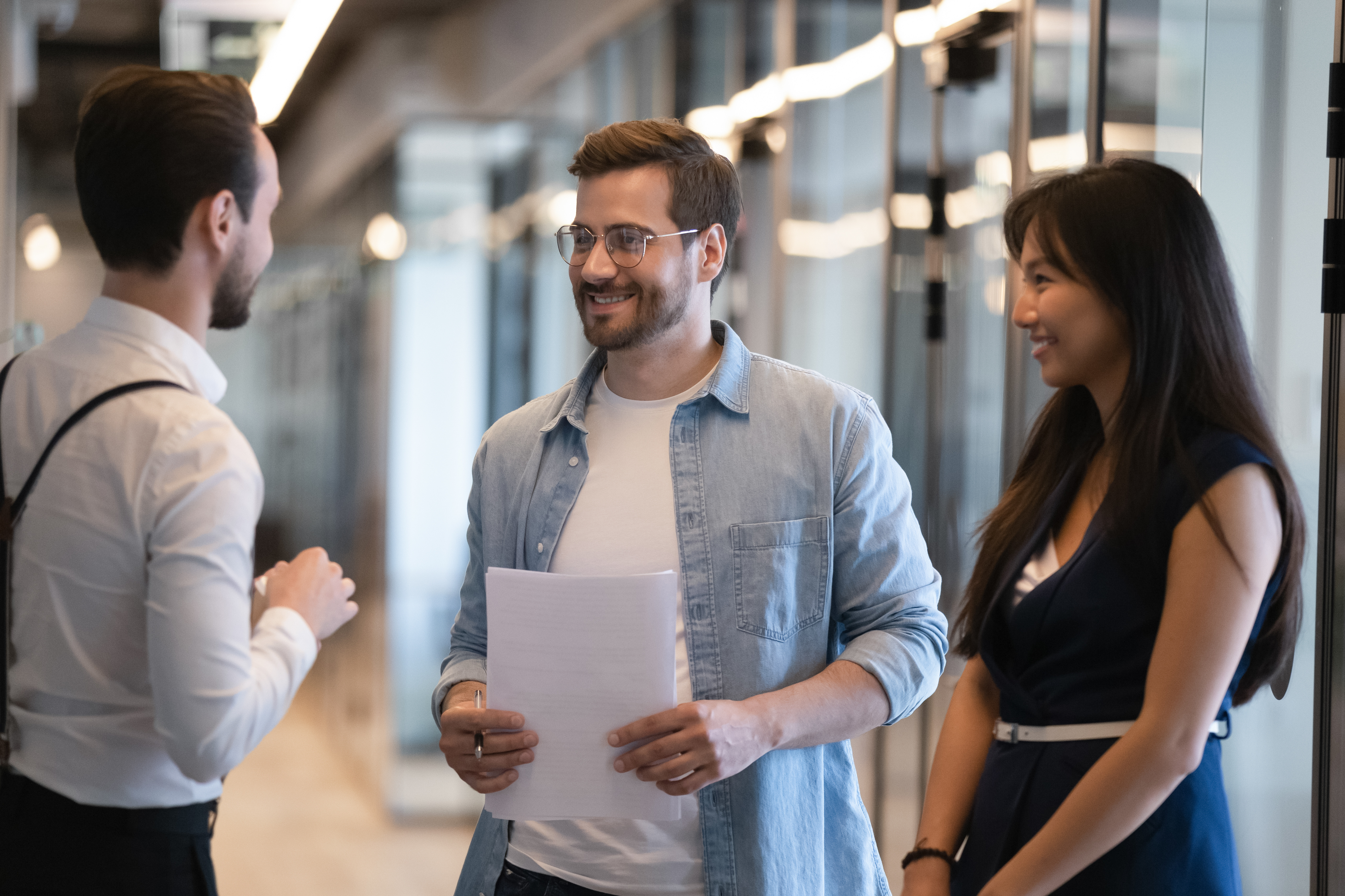 smiling_diverse_colleagues_talking.jpeg
