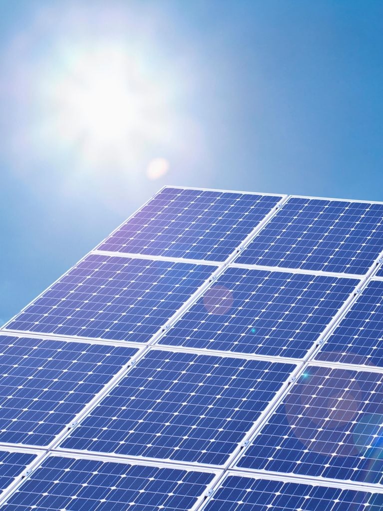 solar_panels_against_blue_sky.jpg