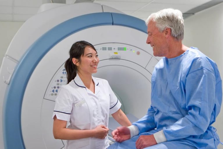 Radiologist and patient scan 