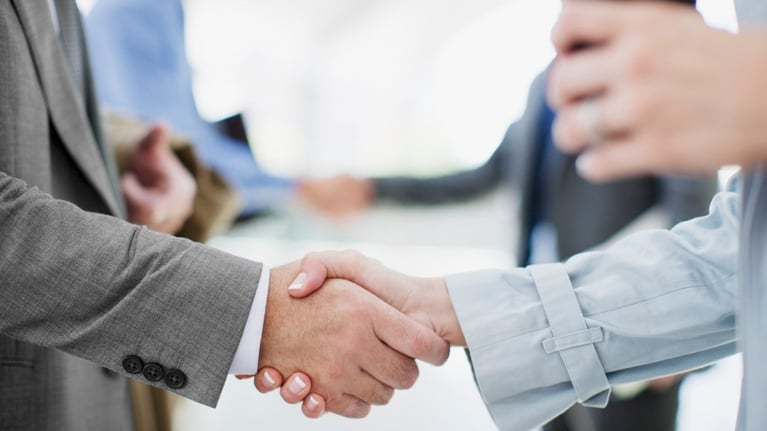 Businesspeople shake hands 1280X720