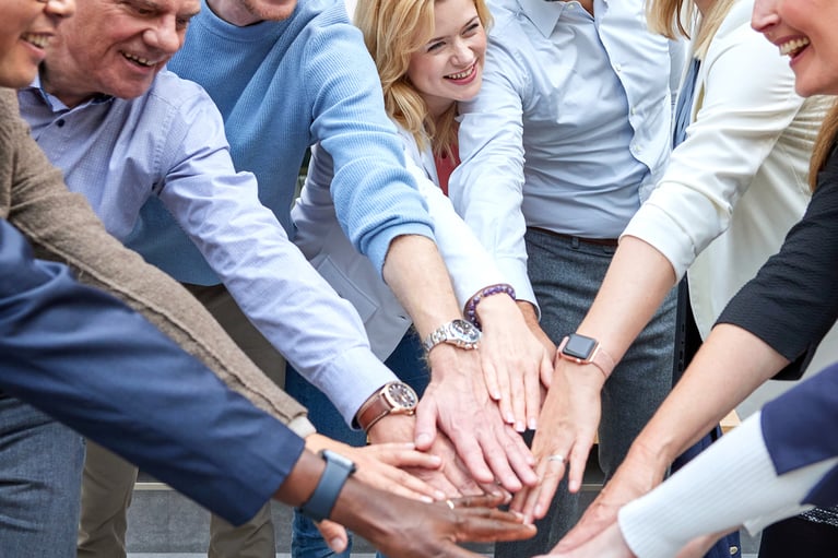 employees-put-their-hands-together-2.jpg