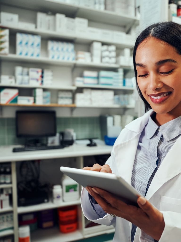 smiling-pharmacist-with-tablet-pc.jpeg