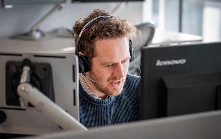 Man-with-headset-taking-a-call.jpg