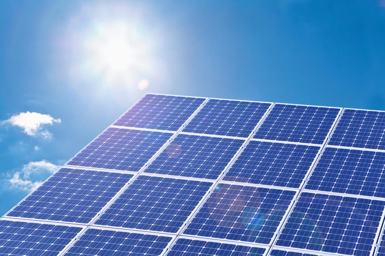 solar_panels_against_blue_sky.jpg