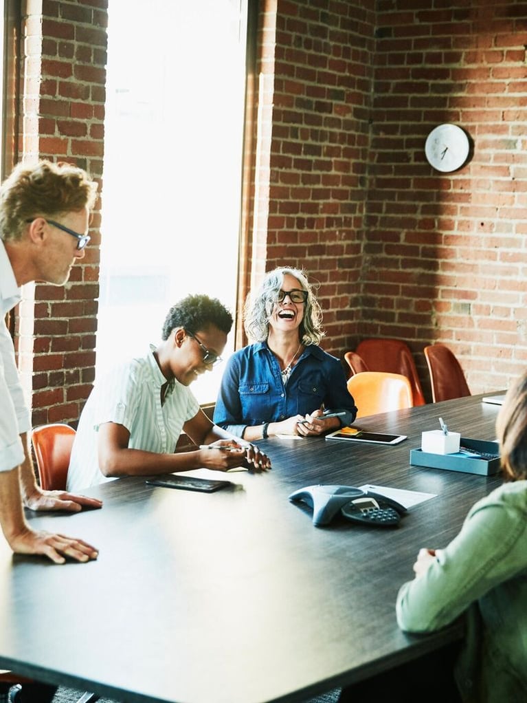 laughing colleagues meeting