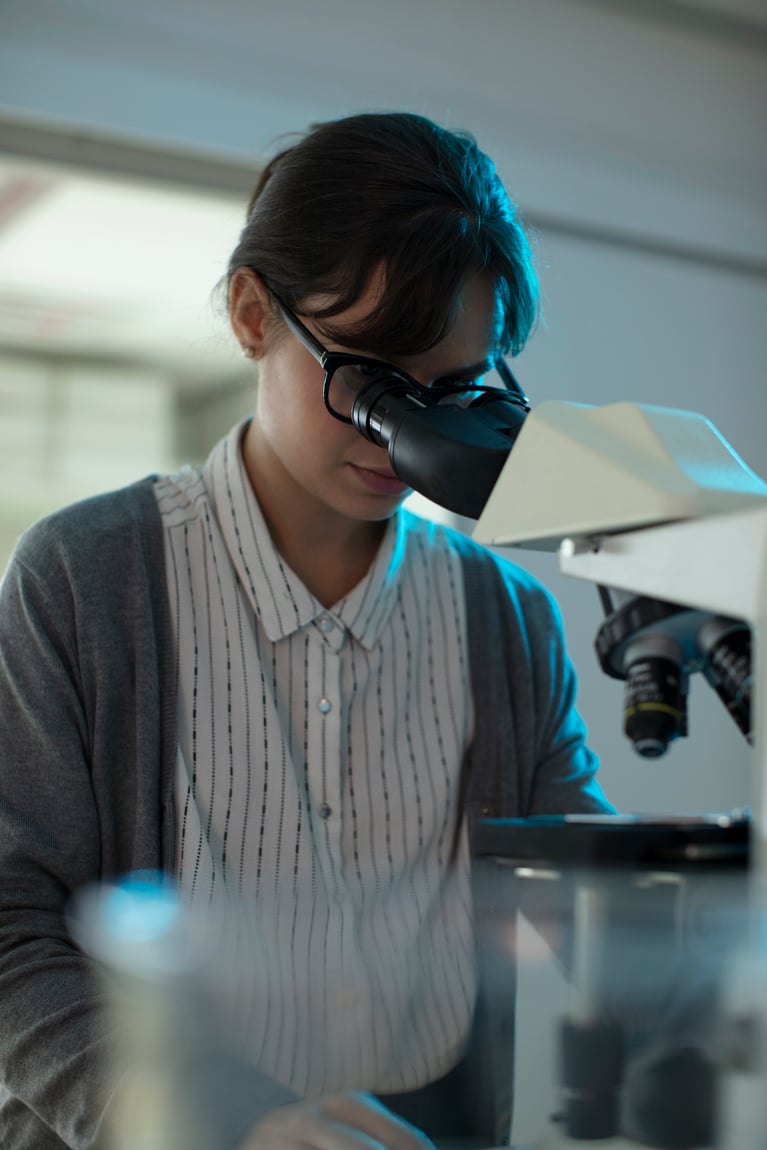 researcher_looking_into_microscope.jpg