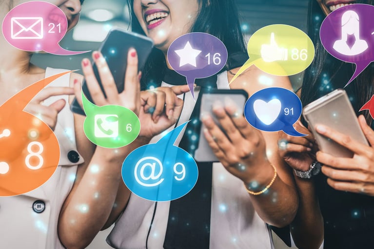 Group of people with cell phones looking at social media