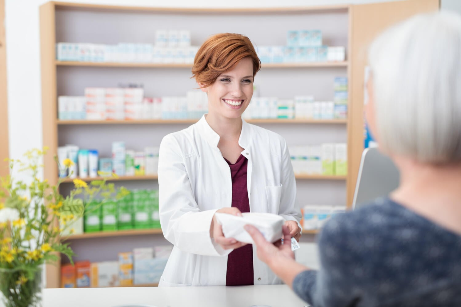 pharmacist-passing-medicine