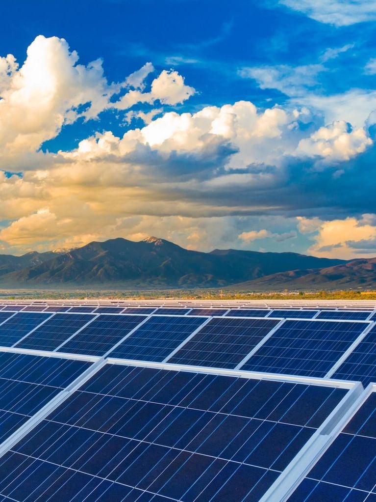 mountains behind solar panels 0