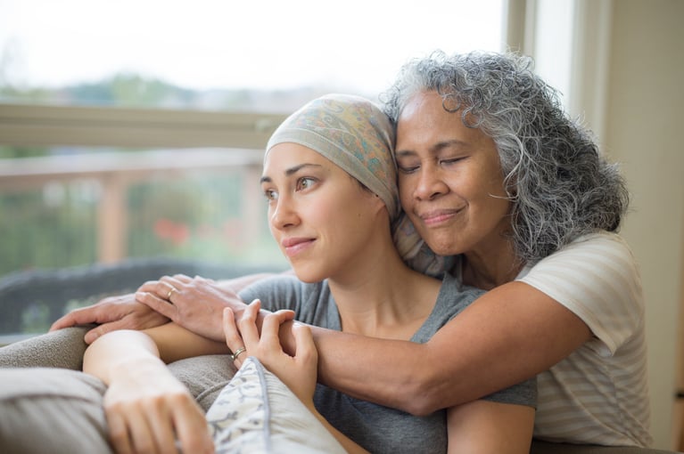 senior_woman_hugging_her_daughter.jpeg