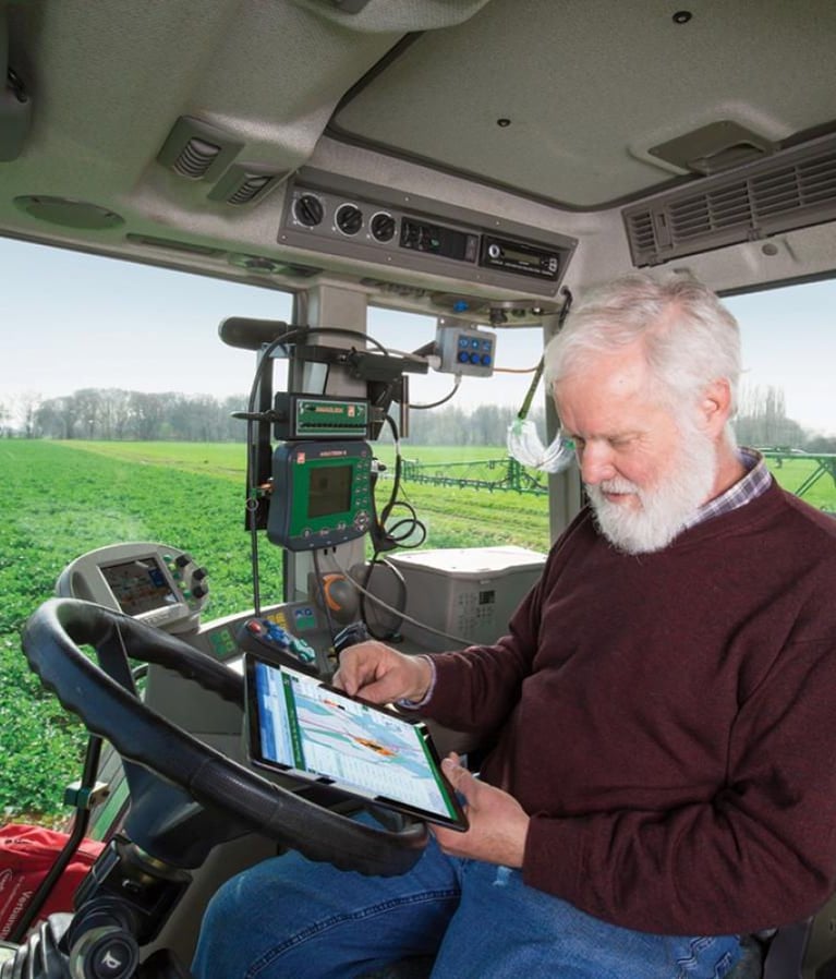 Digital farming expert in a tractor