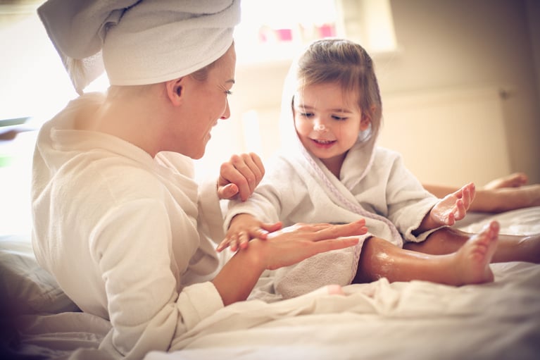 mother_and_daughter_applying_body_lotion.jpg