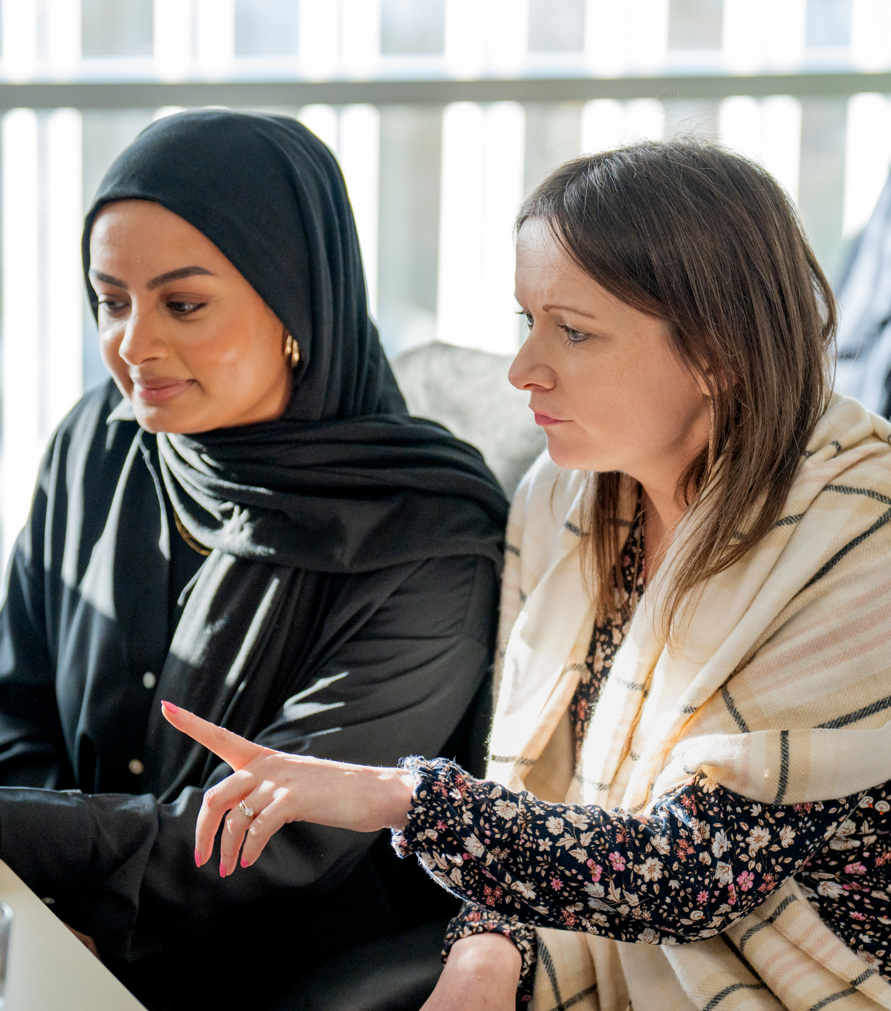 Two-women-looking-at-laptop.jpg