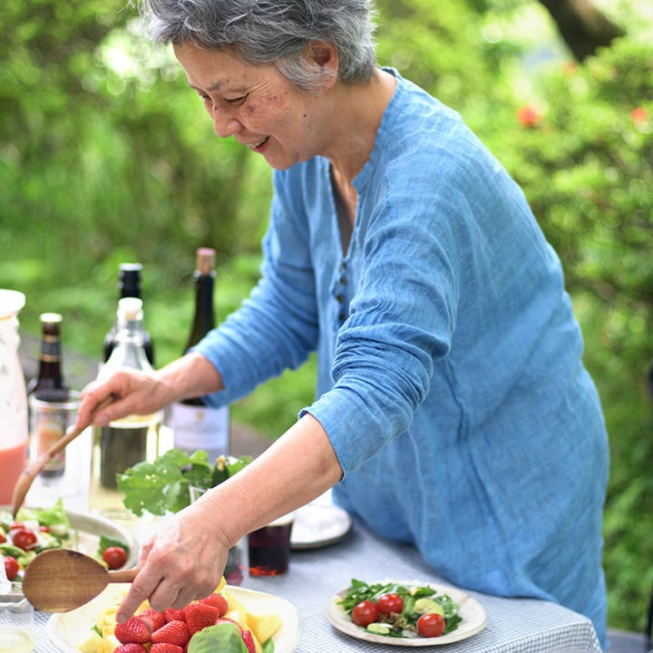 japanese woman preparing meal in garden