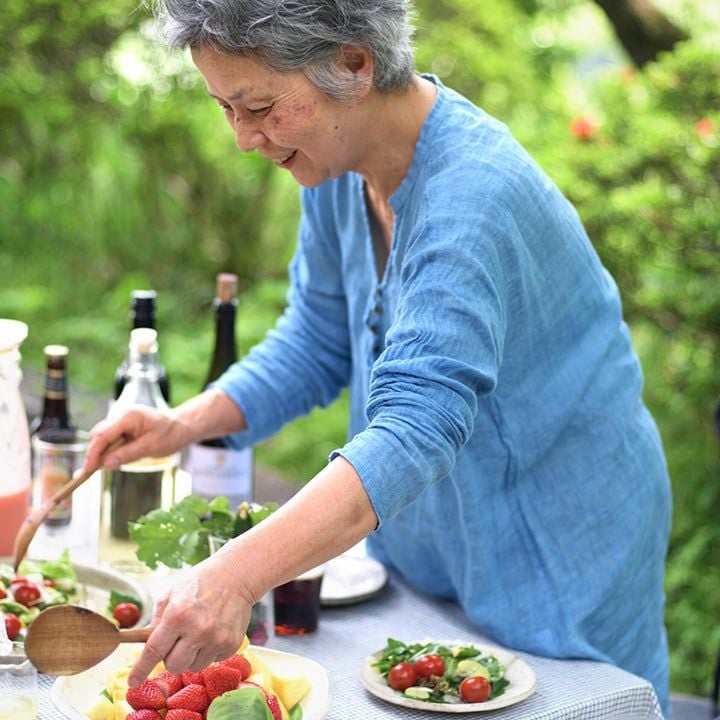 japanese woman preparing meal in garden