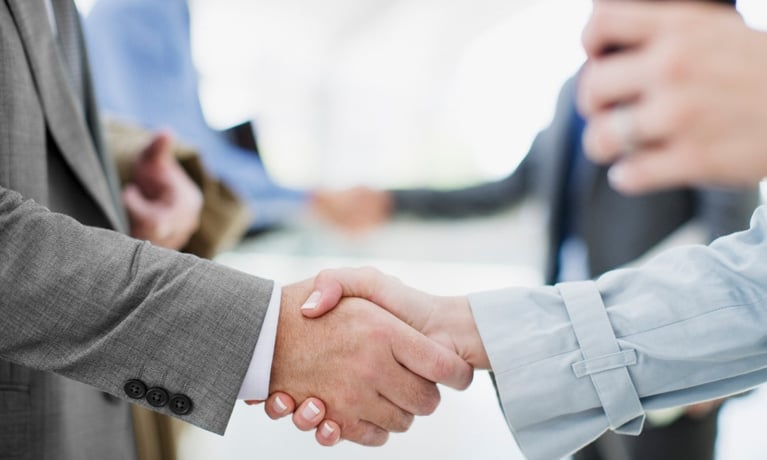 Businesspeople shake hands 1280X720