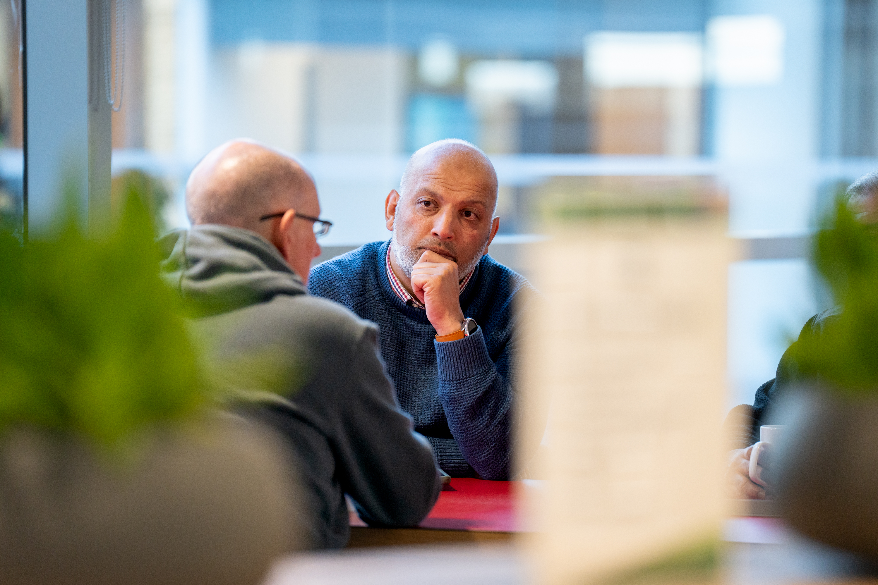 two-men-discussing-over-a-table.jpg