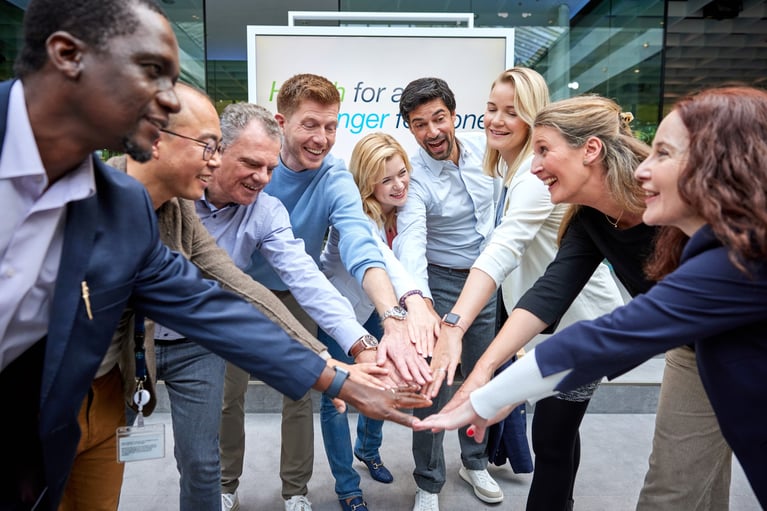 employees put their hands together 2