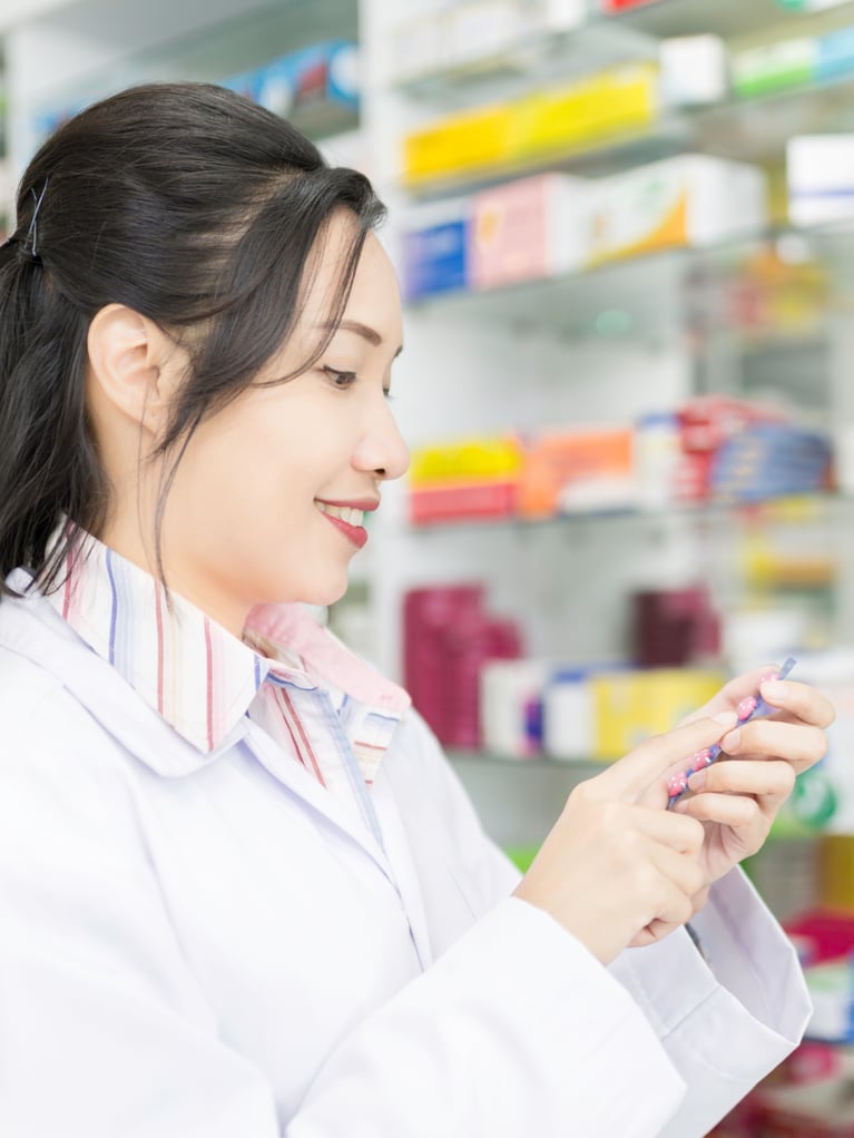 asian_pharmacist_in_a_drug_store.jpg