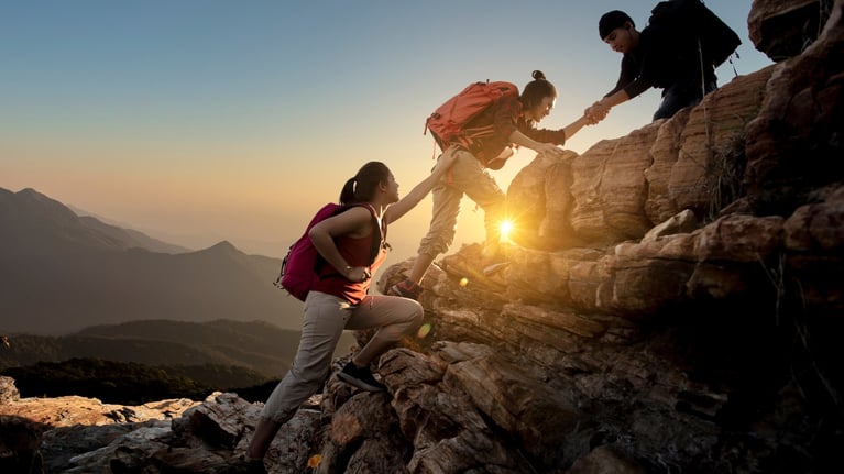 asian-hikers-helping-each-other-1920.jpg