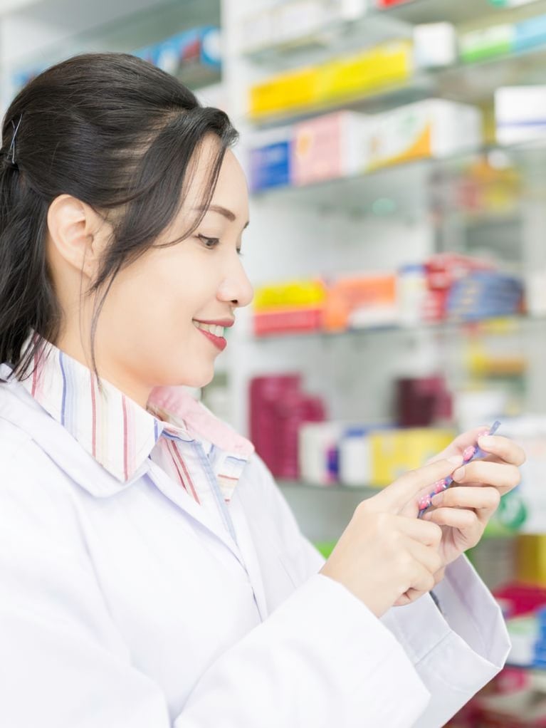 asian_pharmacist_in_a_drug_store.jpg