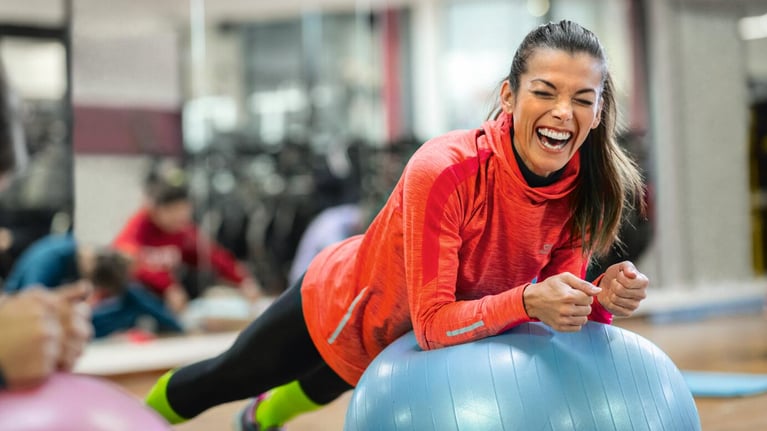 laughing woman at a gym
