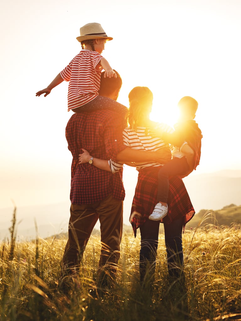 young-family-enjoying-sunset.jpeg