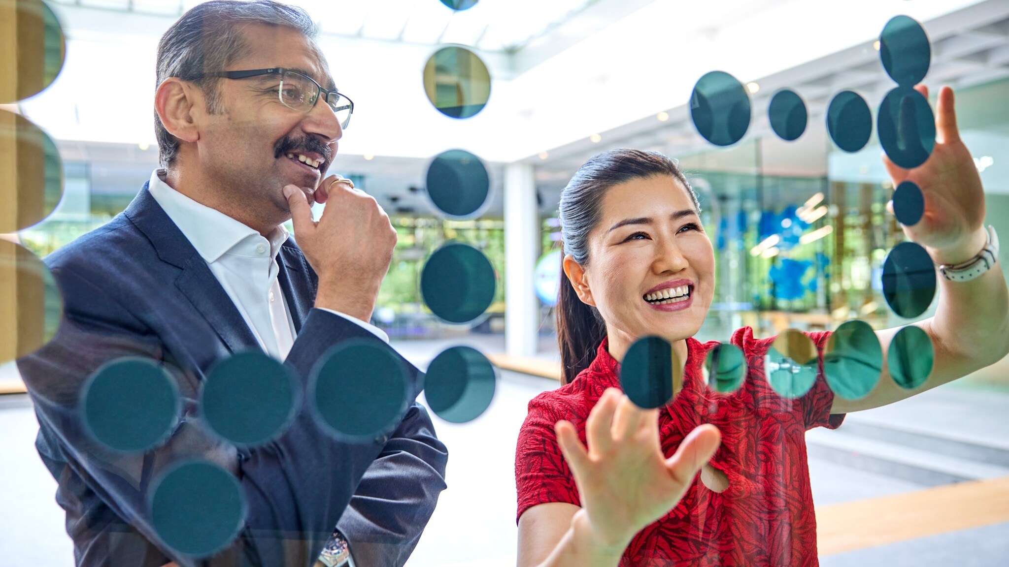 bayer employees discussing 14 16x9